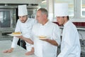 Chef showing the dessert Royalty Free Stock Photo