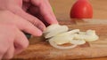 Chef slices onion. knife, cutting onion. Healthy food. Close-up.