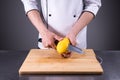 Chef slices and peels ripe mango in the restaurant kitchen1