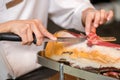 Chef slices serrano ham. Jamon Serrano. Typical Spanish delicate Royalty Free Stock Photo