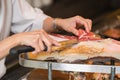 Chef slices serrano ham. Jamon Serrano. Typical Spanish delicate Royalty Free Stock Photo