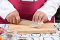 Chef slicing eringi for cooking Royalty Free Stock Photo