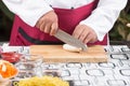 Chef slicing eringi for cooking Royalty Free Stock Photo