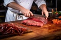 chef slicing freshly cooked beef brisket