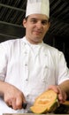 Chef is slicing a melon Royalty Free Stock Photo