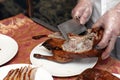 Chef slicing peking duck