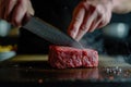 Chef slicing a perfect piece of Wagyu beef, culinary precision and quality
