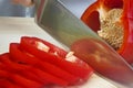 Chef Slicing A Red Pepper With Sharp Knife