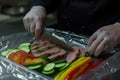 chef slicing vegetables to prepare with sousvide meat Royalty Free Stock Photo