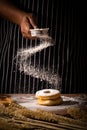 Chef spreading flour on bakery prepare for baking. Cook showing