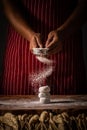 Chef spreading flour on bakery prepare for baking. Cook showing Royalty Free Stock Photo