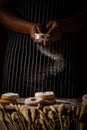 Chef spreading flour on bakery prepare for baking. Cook showing Royalty Free Stock Photo