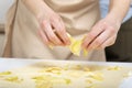 Chef spreads the apple slices on to the thinly rolled dough. Apple pie making process