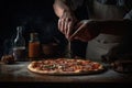 Chef sprinkling pepperoni pizza on wooden table in dark room, In a close-up view, the hands of a chef skillfully assemble a