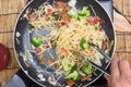 Chef stir fried Spaghetti with tongs Royalty Free Stock Photo