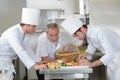 chef supervising trainees cooking Royalty Free Stock Photo