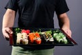 chef with a sushi tray, set rolls sushi japanese asian traditional food Royalty Free Stock Photo