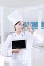 Chef with tablet and delicious hand gesture Royalty Free Stock Photo