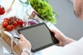 Chef Tablet Showing Organic Vegetable Recipe