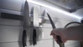 Chef takes sharp knife before cooking, kitchen stuff, steel knife, cooking the dish