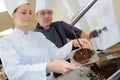 chef team in restaurant kitchen with dessert working together Royalty Free Stock Photo