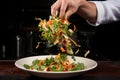 chef tossing thai salad