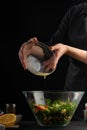 Chef whips salad dressing., Freeze in motion. Salad, organic ingredients and products. Vegetarian and tasty food. Vertical shot
