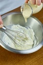 Chef whisk mayonnaise in a bowl in hand a series of full cooking food recipes