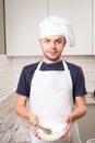 Chef whisked eggs and meal in a bowl Royalty Free Stock Photo