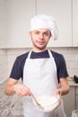 Chef whisked eggs and meal in a bowl Royalty Free Stock Photo