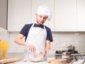 Chef whisked eggs and meal in a bowl Royalty Free Stock Photo