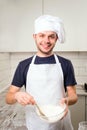 Chef whisked eggs and meal in a bowl Royalty Free Stock Photo