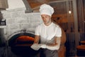Chef in a white uniform prepare a pizzaa Royalty Free Stock Photo