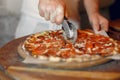 Chef in a white uniform prepare a pizzaa Royalty Free Stock Photo