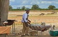 Chef preparing breakfast in the bush for safari guests, Hwange National Park, 2013