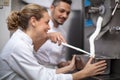 chef and woman assistant filling ice cream