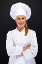 Chef woman over dark bacground standing