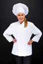 Chef woman over dark bacground standing