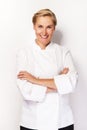 Chef woman over white background with crosed arms smiling.