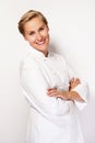 Chef woman over white background with crosed arms smiling.