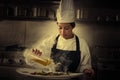 Chef woman working in kitchen with smoke Royalty Free Stock Photo