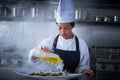 Chef woman working in kitchen with smoke Royalty Free Stock Photo