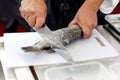 Chef at work, chef filleting fish at the kitchen, Chef in restaurant kitchen filleting fish