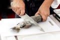 Chef at work, chef filleting fish at the kitchen, Chef in restaurant kitchen filleting fish Royalty Free Stock Photo