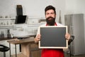 Chef at work. I need you at the kitchen. Hipster in kitchen. Mature male. Bearded man cook. Bearded man in red apron Royalty Free Stock Photo