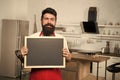 Chef at work. I need you at the kitchen. Hipster in kitchen. Mature male. Bearded man cook. Bearded man in red apron Royalty Free Stock Photo