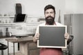 Chef at work. I need you at the kitchen. Hipster in kitchen. Mature male. Bearded man cook. Bearded man in red apron Royalty Free Stock Photo