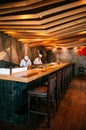 Chef working at Japanese Sushi bar with vaibrant interior, Wood