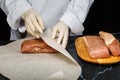 Chef wraps the salty meat for further drying