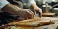 Professional chef meticulously preparing a fish. detail-oriented culinary art in a modern kitchen setting. perfect for Royalty Free Stock Photo